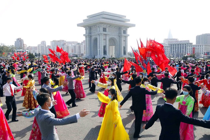 Students and youth of Pyongyang participate in a dancing party to commemorate the 10th anniversary of Kim Jong Uns election as the top party and state leader at the plaza of Arch of Triumph in Pyongyang, North Korea Monday, April 11, 2022. (AP Photo/Jon Chol Jin)