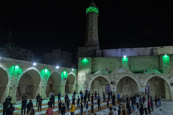 GAZA CITY, GAZA - APRIL 12: Muslims perform the first 'Tarawih' prayers of the holy month of Ramadan at Al-Omari Mosque on April 12, 2021 in Gaza City, Gaza. Millions of Muslims around the world began observing the holy month of Ramadan amid the ongoing coronavirus pandemic. (Photo by Fatima Shbair/Getty Images)