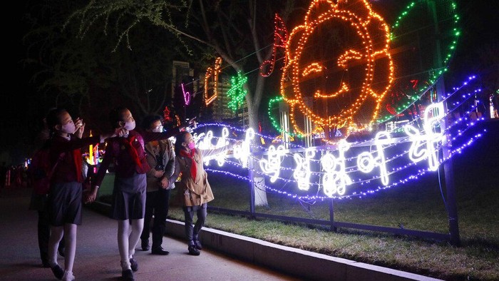 Citizens visit a light festival in celebration of 110th birth anniversary of their late leader Kim Il Sung at Kim Il Sung Square in Pyongyang, North Korea Thursday, April 14, 2022. (AP Photo/Cha Song Ho)