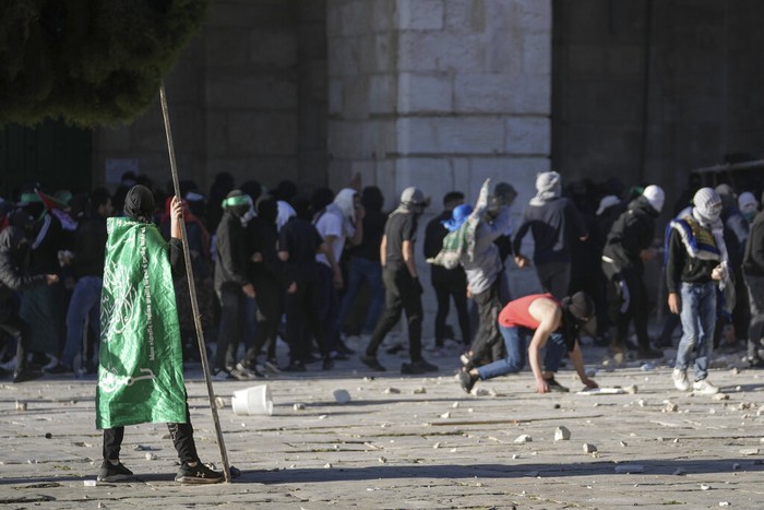 Israeli security forces take position during clashes with Palestinians demonstrators at the Al Aqsa Mosque compound in Jerusalems Old City, Friday, April 15, 2022. (AP Photo/Mahmoud Illean)