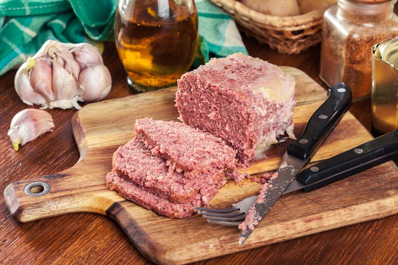 Delicious sliced corned beef on cutting board