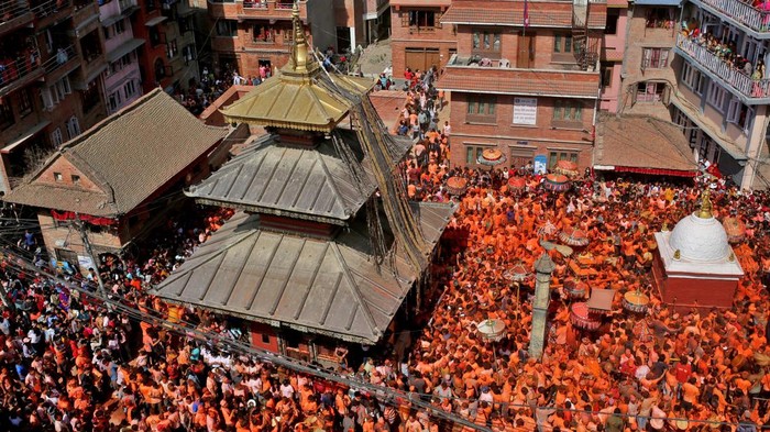 NEPAL-RELIGION/ A devotee reacts as vermilion powder is applied on his face during the