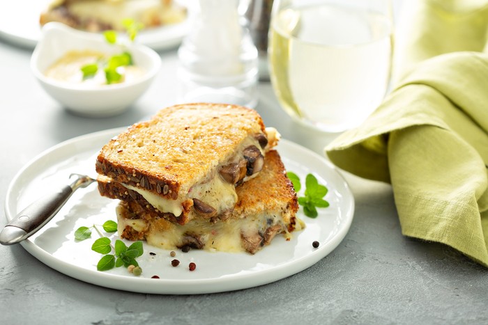 Mushroom grilled cheese sandwich on multigrain bread with thyme