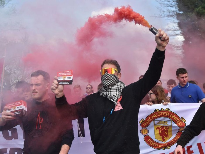 MANCHESTER, ENGLAND - APRIL 16: Manchester United fans take part in a protest outside the stadium prior to the Premier League match between Manchester United and Norwich City at Old Trafford on April 16, 2022 in Manchester, England. (Photo by Nathan Stirk/Getty Images)