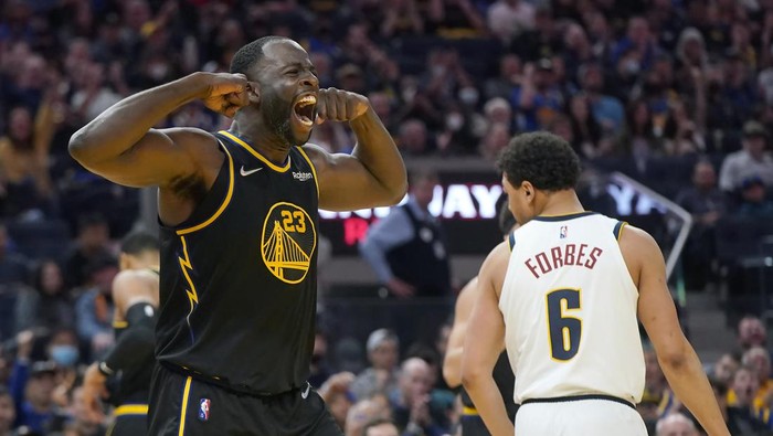 Golden State Warriors forward Draymond Green celebrates after scoring against the Denver Nuggets during the second half of Game 1 of an NBA basketball first-round playoff series in San Francisco, Saturday, April 16, 2022. (AP Photo/Jeff Chiu)