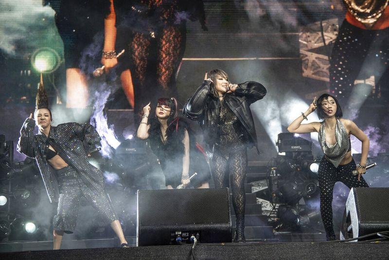 EDS NOTE: OBSCENITY - Dara, from left, Park Bom, CL, and Minzy of 2NE1 perform at the Coachella Music & Arts Festival at the Empire Polo Club on Saturday, April 16, 2022, in Indio, Calif. (Photo by Amy Harris/Invision/AP)