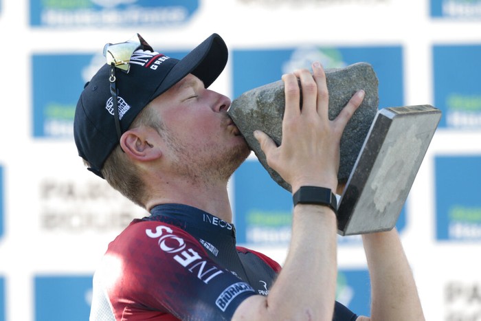 France Cycling Paris Roubaix Race winner, Netherland's Dylan Van Baarle, center, Wout van Aert of Belgium, left, second and Stefan Kung of Switzerland, third, pose on the podium after the Paris-Roubaix cycling race, a 257 kilometer (160 mile) one-day-race at the velodrome in Roubaix, northern France, Sunday, April 17, 2022. (AP Photo/Michel Spingler)