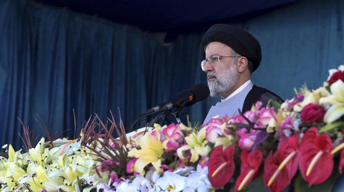 In this photo released by the official website of the office of the Iranian Presidency, President Ebrahim Raisi reviews the army troops parade commemorating National Army Day in front of the mausoleum of the late revolutionary founder Ayatollah Khomeini Monday, April 18, 2022, outside Tehran, Iran. Raisi warned that Israel will be targeted by his countrys armed forces if it makes 