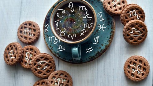 Coffee with cookies and astrological zodiac symbols