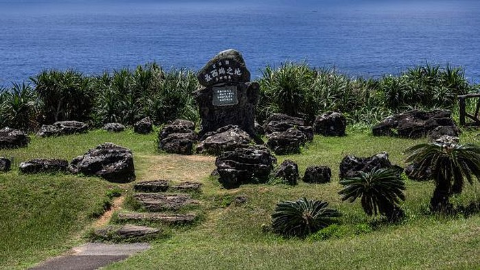 Menyusuri Yonaguni, Pulau Paling Barat di Jepang YONAGUNI, JAPAN - APRIL 13: A boy walks past houses on April 13, 2022 on Yonaguni, Japan. As Japans westernmost inhabited island, just 111 kilometres away from Taiwan and located close to the disputed Senkaku Islands, Yonaguni has seen an increased military presence as the Japanese government looks to ward off Chinese activity in nearby territory claimed by both countries. Japans Air Self-Defense Force has recently announced that it will permanently station a mobile radar unit on the island, adding to an existing military radar station which allows monitoring of the Chinese mainland and tracking of Chinese ships and aircraft in the area. Japans Ground Self-Defense Force also plans to deploy an electronic warfare unit to Yonaguni in 2023. (Photo by Carl Court/Getty Images)