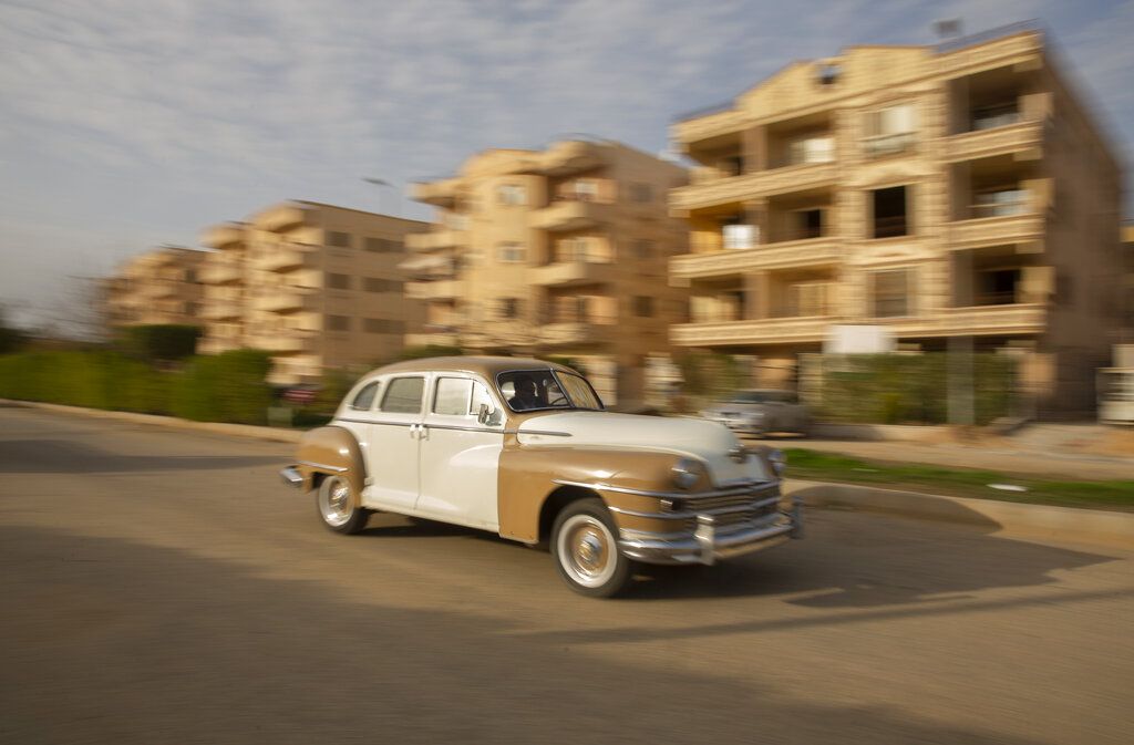 Automobile enthusiasts visit a classic car show in Cairo, Egypt, March 19, 2022. (AP Photo/Amr Nabil)
