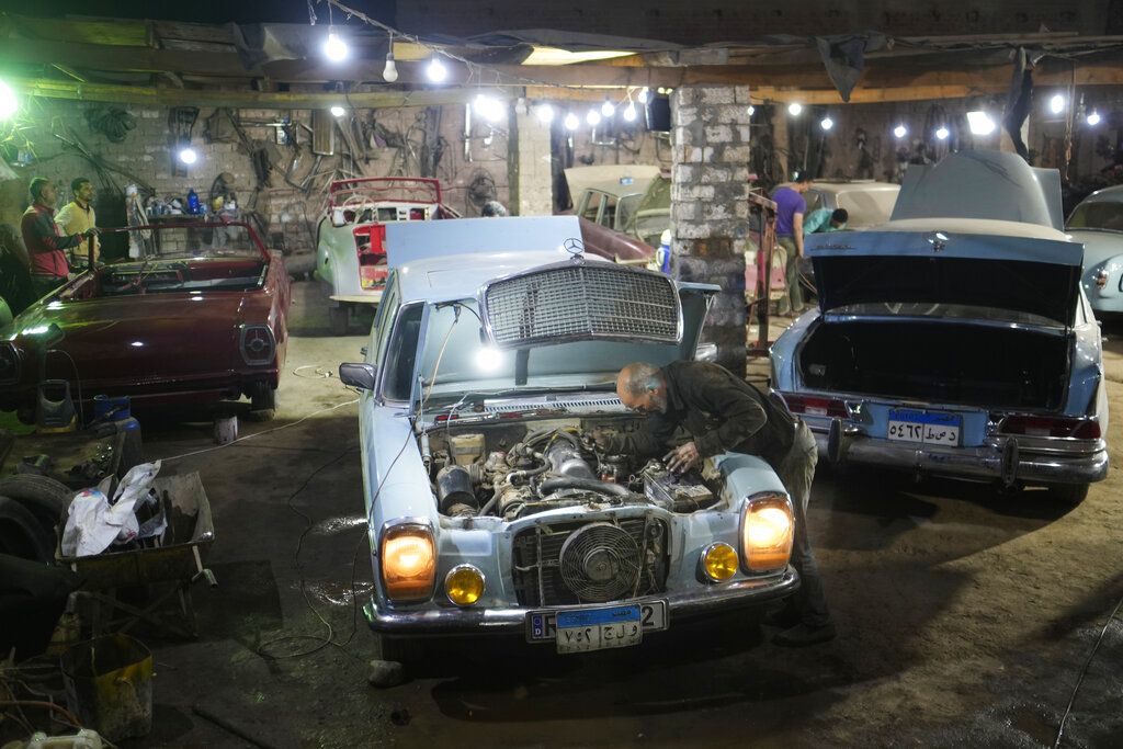Automobile enthusiasts visit a classic car show in Cairo, Egypt, March 19, 2022. (AP Photo/Amr Nabil)