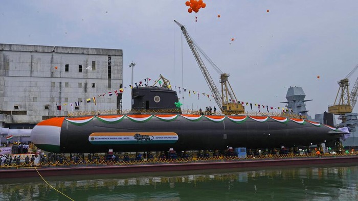 A security officer stands guard during the launch of Vagsheer, India's sixth Scorpene class submarine, in Mumbai, India, Wednesday, April 20, 2022.(AP Photo/Rafiq Maqbool)