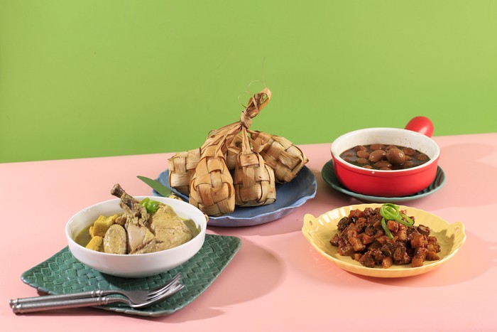 Ketupat Sayur typical Lebaran, served with Opor Ayam, Semur Telur Puyuh, and Sambal Goreng Ati Kentang. Special dishes during Eid al-Fitr and Eid al-Adha, especially in Indonesia.