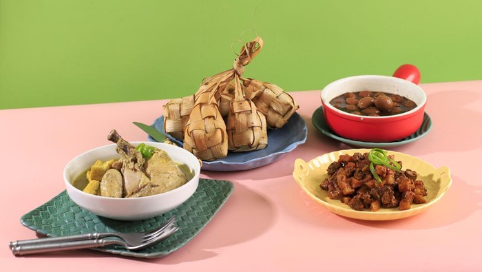 Ketupat Sayur typical Lebaran, served with Opor Ayam, Semur Telur Puyuh, and Sambal Goreng Ati Kentang. Special dishes during Eid al-Fitr and Eid al-Adha, especially in Indonesia.