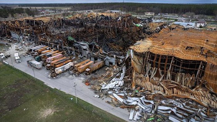 MAKARIV, UKRAINE - APRIL 19: (EDITORS NOTE: This photograph was taken using a drone) As seen from the air, the massive Komodor logistics park lies in ruins, after being bombed and burnt during the Russian invasion on April 19, 2022 near Makariv, Ukraine. The attack in early March destroyed some $50 million of medicines and medical raw materials for Ukrainian pharmaceutical company Farmac, according to Forbes. Losses for other tenants of the 400,000 square meter facility are yet unknown. (Photo by John Moore/Getty Images)
