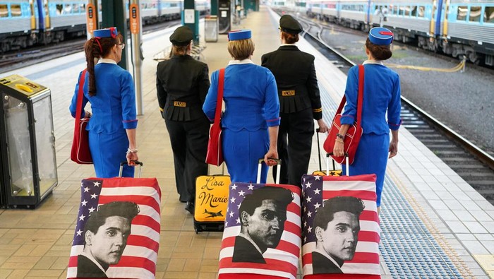 Elvis Presley impersonators Steve Fletcher and Len Connolly board a train at Sydney Central Railway Station before departing for the Parkes Elvis Festival, as the event returns following the coronavirus disease (COVID-19) pandemic, in Sydney, Australia, April 21, 2022.  REUTERS/Loren Elliott