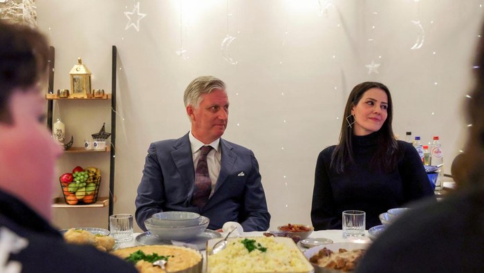 Belgium's King Philippe is hosted by a Muslim Joukhadar family to celebrate Iftar, which marks the breaking of the fast during the holy month of Ramadan in Ham, Belgium, April 21, 2022. REUTERS/Johanna Geron/Pool