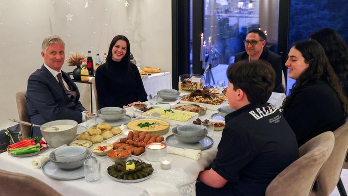 Belgium's King Philippe is hosted by a Muslim Joukhadar family to celebrate Iftar, which marks the breaking of the fast during the holy month of Ramadan in Ham, Belgium, April 21, 2022. REUTERS/Johanna Geron/Pool