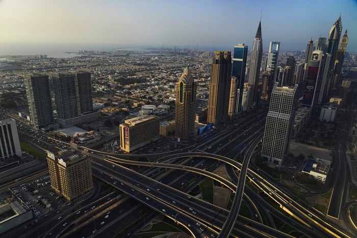 The Jumeirah neighborhood is seen with the Burj Khalifa, the worlds tallest building, visible in the distance in Dubai, United Arab Emirates, Friday, April 22, 2022. (AP Photo/Jon Gambrell)