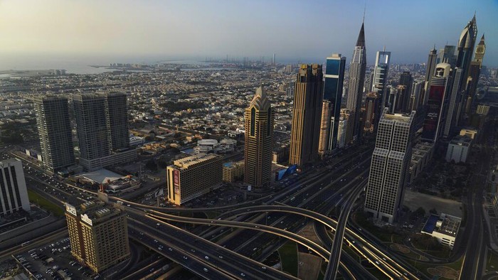 The Jumeirah neighborhood is seen with the Burj Khalifa, the worlds tallest building, visible in the distance in Dubai, United Arab Emirates, Friday, April 22, 2022. (AP Photo/Jon Gambrell)