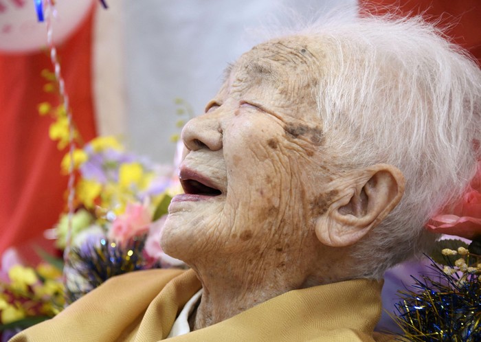 FILE PHOTO: 116-year-old Japanese woman Kane Tanaka celebrates during a ceremony to recognise her as the worlds oldest person living and worlds oldest woman living by the Guinness World Records in Fukuoka, Japan March 9, 2019.  Mandatory credit Kyodo/via REUTERS  ATTENTION EDITORS - THIS IMAGE WAS PROVIDED BY A THIRD PARTY. MANDATORY CREDIT. JAPAN OUT. THIS IMAGE WAS PROCESSED BY REUTERS TO ENHANCE QUALITY, AN UNPROCESSED VERSION HAS BEEN PROVIDED SEPARATELY./File Photo