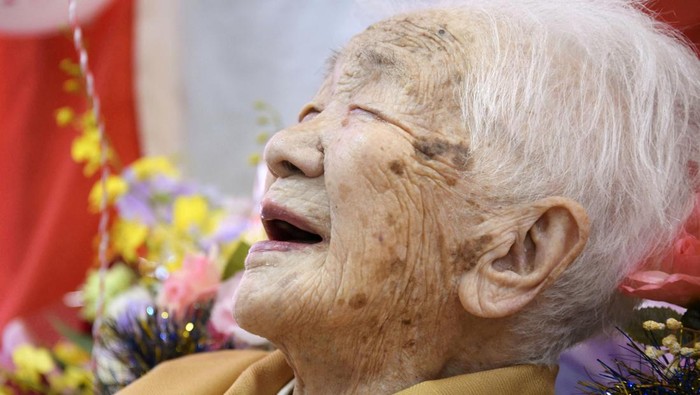 FILE PHOTO: 116-year-old Japanese woman Kane Tanaka celebrates during a ceremony to recognise her as the world's oldest person living and world's oldest woman living by the Guinness World Records in Fukuoka, Japan March 9, 2019.  Mandatory credit Kyodo/via REUTERS  ATTENTION EDITORS - THIS IMAGE WAS PROVIDED BY A THIRD PARTY. MANDATORY CREDIT. JAPAN OUT. THIS IMAGE WAS PROCESSED BY REUTERS TO ENHANCE QUALITY, AN UNPROCESSED VERSION HAS BEEN PROVIDED SEPARATELY./File Photo
