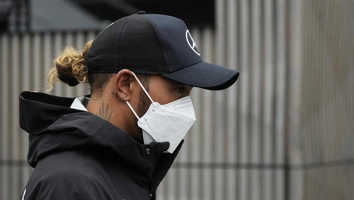 Mercedes driver Lewis Hamilton of Britain arrives in the paddock at the Dino and Enzo Ferrari racetrack, in Imola, Italy, Thursday, April 21, 2022. Italys Emila Romagna Formula One Grand Prix will take place on Sunday. (AP Photo/Luca Bruno)