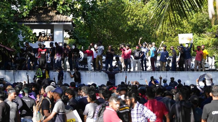 Sri Lankan university students push down police barricades during a protest over the country’s worst economic crisis in decades outside the residence of prime minister Mahinda Rajapaksa in Colombo, Sri Lanka, Sunday, April 24, 2022. (AP Photo/Eranga Jayawardena)