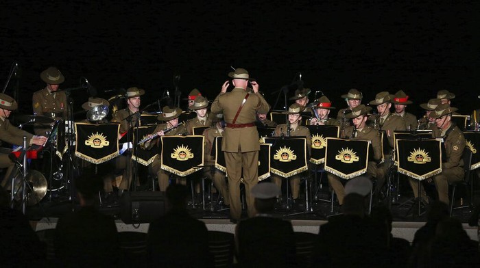 Turkey Gallipoli A military band performs during the Dawn Service ceremony at the Anzac Cove beach, the site of the April 25, 1915, World War I landing of the ANZACs (Australian and New Zealand Army Corps) on the Gallipoli peninsula, Turkey, early Monday, April 25, 2022. Travelers from Australia and New Zealand joined Turkish and other nations' dignitaries at the former World War I battlefields for a dawn service Monday to remember troops killed during an unsuccessful British-led campaign that aimed to take the Ottoman Empire out of the war. (AP Photo/Emrah Gurel)