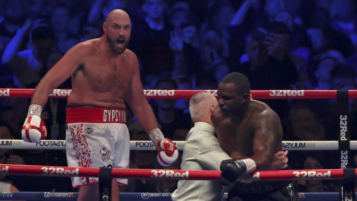 Britains Tyson Fury, left, celebrates after beating Britains Dillian Whyte during their WBC heavyweight title boxing fight at Wembley Stadium in London, Saturday, April 23, 2022. (AP Photo/Ian Walton)
