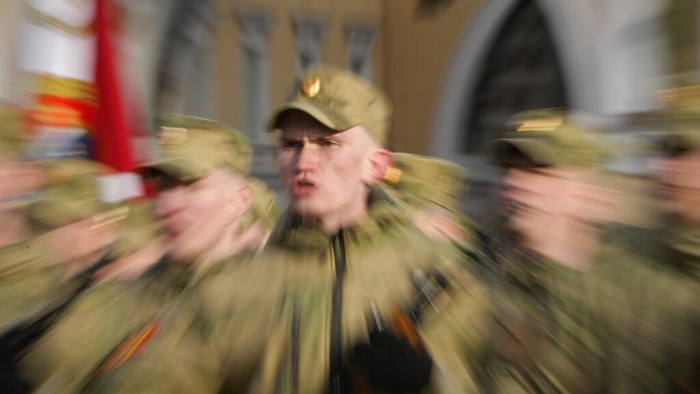 A soldier of Russian Rosguardia (National Guard) with an attached letter Z, which has become a symbol of the Russian military, stands guard during a rehearsal for the Victory Day military parade which will take place at Dvortsovaya (Palace) Square on May 9 to celebrate 77 years after the victory in World War II in St. Petersburg, Russia, Tuesday, April 26, 2022. (AP Photo/Dmitri Lovetsky)