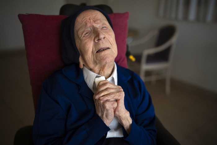 Sister Andre poses for a portrait at the Sainte Catherine Laboure care home in Toulon, southern France, Wednesday, April 27, 2022. With the death of Kane Tanaka at age 119, the worlds oldest human is now Lucile Randon, a French nun known as Sister Andre, aged 118, according to the The Gerontology Research Group. (AP Photo/Daniel Cole)