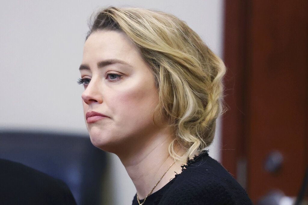 Actress Amber Heard appears in the courtroom during a hearing at the Fairfax County Circuit Court in Fairfax, Va., Tuesday April 19, 2022. Actor Johnny Depp sued his ex-wife Heard for libel in Fairfax County Circuit Court after she wrote an op-ed piece in The Washington Post in 2018 referring to herself as a 