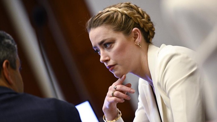 Actress Amber Heard appears in the courtroom during a hearing at the Fairfax County Circuit Court in Fairfax, Va., Tuesday April 19, 2022. Actor Johnny Depp sued his ex-wife Heard for libel in Fairfax County Circuit Court after she wrote an op-ed piece in The Washington Post in 2018 referring to herself as a 