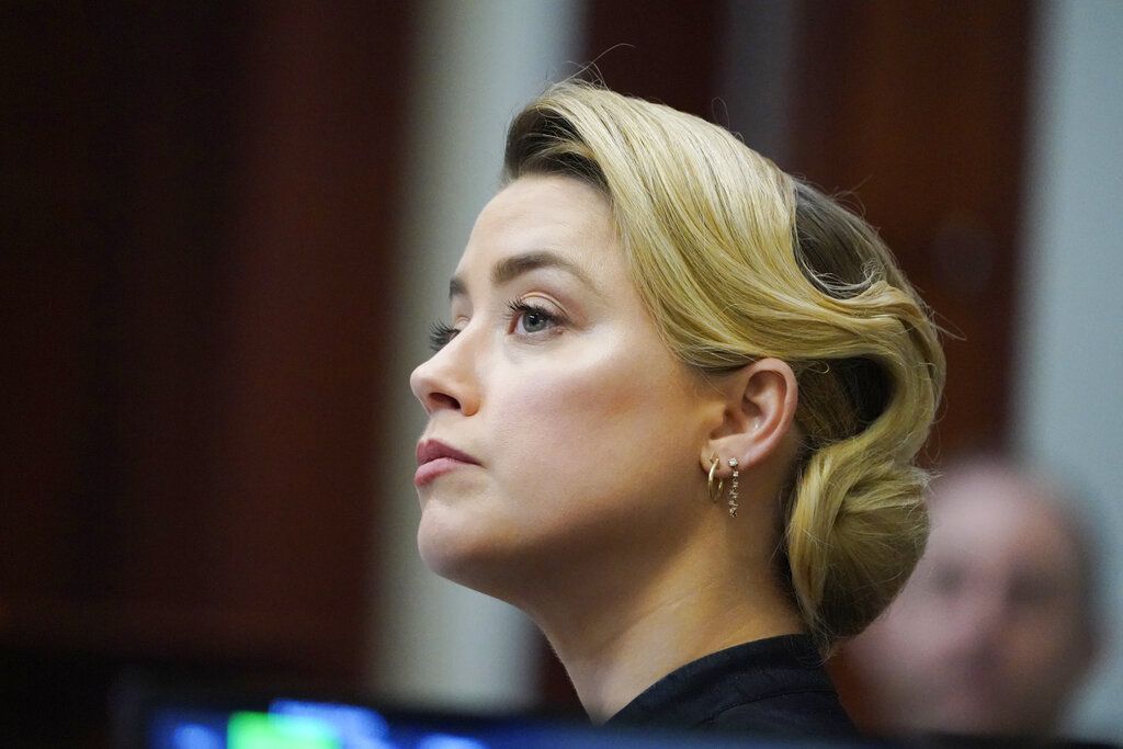 Actress Amber Heard appears in the courtroom during a hearing at the Fairfax County Circuit Court in Fairfax, Va., Tuesday April 19, 2022. Actor Johnny Depp sued his ex-wife Heard for libel in Fairfax County Circuit Court after she wrote an op-ed piece in The Washington Post in 2018 referring to herself as a 