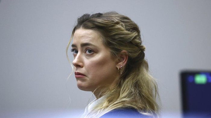 Actress Amber Heard appears in the courtroom during a hearing at the Fairfax County Circuit Court in Fairfax, Va., Tuesday April 19, 2022. Actor Johnny Depp sued his ex-wife Heard for libel in Fairfax County Circuit Court after she wrote an op-ed piece in The Washington Post in 2018 referring to herself as a 
