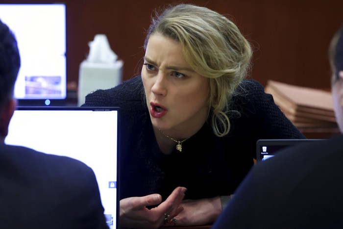 Actress Amber Heard appears in the courtroom during a hearing at the Fairfax County Circuit Court in Fairfax, Va., Tuesday April 19, 2022. Actor Johnny Depp sued his ex-wife Heard for libel in Fairfax County Circuit Court after she wrote an op-ed piece in The Washington Post in 2018 referring to herself as a 