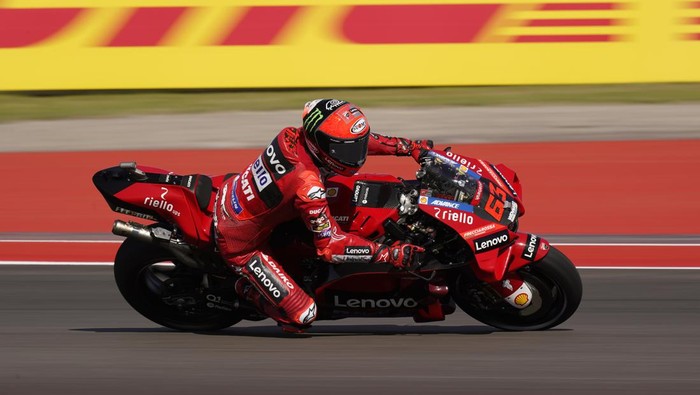 Francesco Bagnaia (63), of Italy, steers through a turn during an open practice session for the MotoGP Grand Prix of the Americas motorcycle race at the Circuit of the Americas, Friday, April 8, 2022, in Austin, Texas. (AP Photo/Eric Gay)