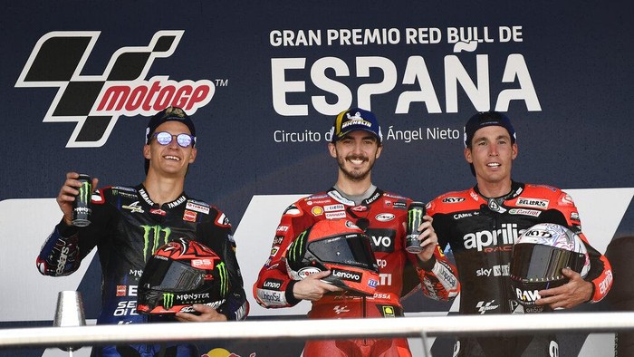 From left, second placed Fabio Quartararo of France, first placed Francesco Bagnaia of Italy, and third placed Aleix Espargaro of Spain, celebrate on the podium at the end of the MotoGP race at the Circuito de Jerez – Angel Nieto in Jerez de la Frontera, Spain, Sunday, May 1, 2022. (AP Photo/Jose Breton)