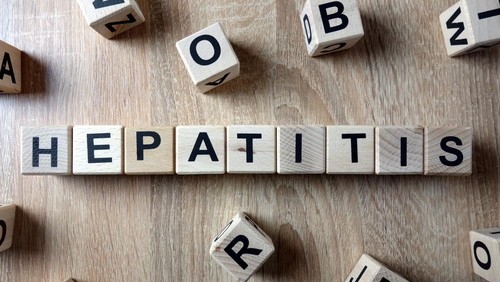Hepatitis word from wooden blocks on desk