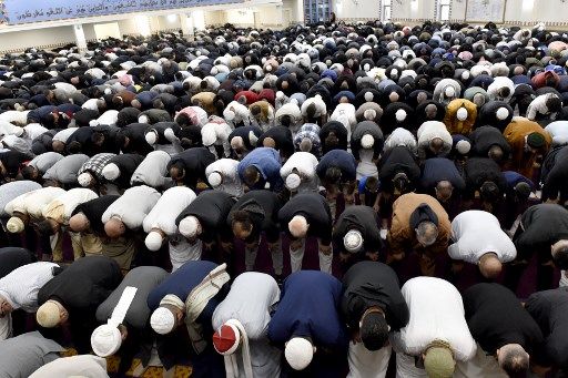 Muslims offer an Eid al-Fitr prayer at the Lekamba mosque in western Sydney on May 2, 2022. - Australian Muslims celebrated the Eid al-Fitr festival on May 2, marking the end of the holy fasting month of Ramadan. (Photo by Muhammad FAROOQ / AFP)