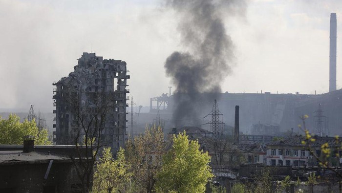 Smoke rises from the Metallurgical Combine Azovstal in Mariupol, in territory under the government of the Donetsk Peoples Republic, eastern Ukraine, Wednesday, May 4, 2022