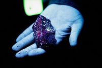 Tungsten is illuminated with mineral light in a mine in Gangwon Province, South Korea, March 31, 2022. Picture taken March 31, 2022. REUTERS/ Heo Ran