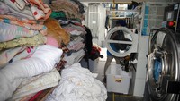 Jasa laundry ini memanfaatkan energi gas bumi untuk kegiatan operasionalnya. (Arif Firmansyah/Antara Foto).