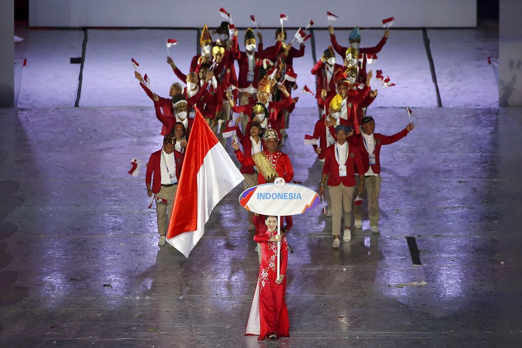 The Indonesia delegation enters the stage during the 31st Southeast Asian Games (SEA Games 31) in Hanoi, Vietnam Thursday, May 12, 2022. The SEA Games 31 takes place from May 12 to May 23 in Hanoi, and 11 nearby provinces. (AP Photo/Minh Hoang)
