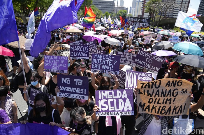 Philippines Marcos A Catholic nun clenches her fist as she joins protesters against presidential frontrunner Ferdinand