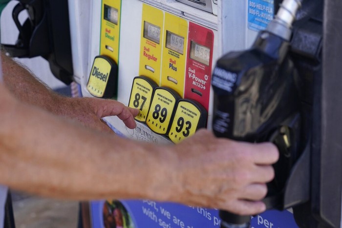 A customer pumps gas at a Shell gas station, Tuesday, May 10, 2022, in Miami. (AP Photo/Marta Lavandier)