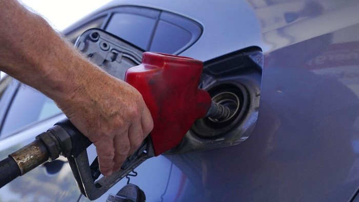 A customer pumps gas at a Shell gas station, Tuesday, May 10, 2022, in Miami. (AP Photo/Marta Lavandier)