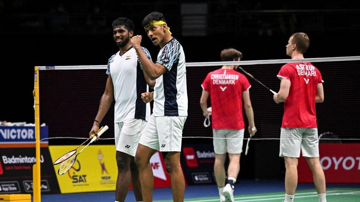 Indias Satwiksairaj Rankireddy (L) and Chirag Shetty (2L) celebrate winning against Denmarks Mathias Christiansen and Kim Astrup during the semifinals of the Thomas and Uber Cup badminton tournament in Bangkok on May 13, 2022. (Photo by Lillian SUWANRUMPHA / AFP) (Photo by LILLIAN SUWANRUMPHA/AFP via Getty Images)